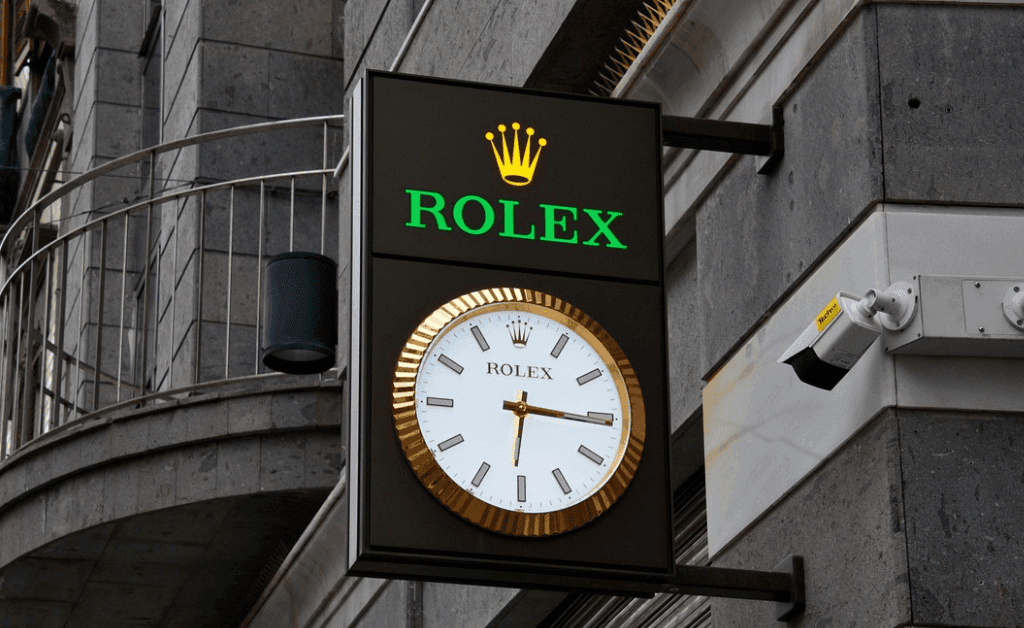 Rolex sign showing the current time in Switzerland, highlighting Swiss precision and luxury watchmaking.