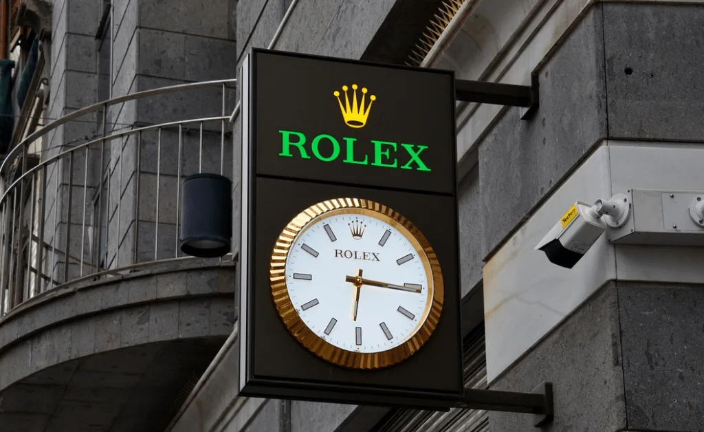 Rolex sign showing the current time in Switzerland, highlighting Swiss precision and luxury watchmaking.