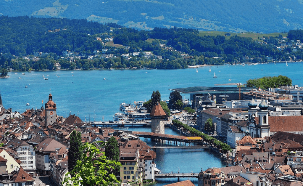 Aerial view of Lucerne, Switzerland, showcasing Lake Lucerne, Chapel Bridge, and the city skyline.