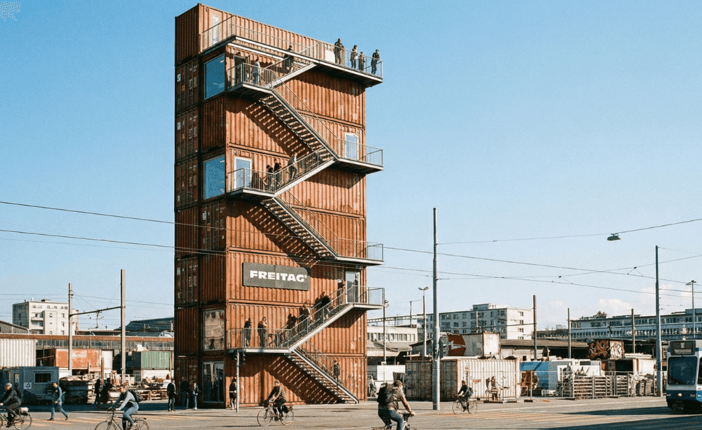 The FREITAG Flagship Store tower in Zürich-West, built from stacked colorful shipping containers.