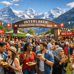 Crowds enjoying the Interlaken Streetfood Festival 2026 with Alps background