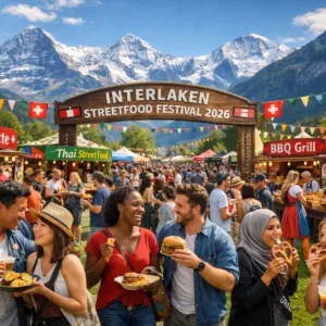 Crowds enjoying the Interlaken Streetfood Festival 2026 with Alps background